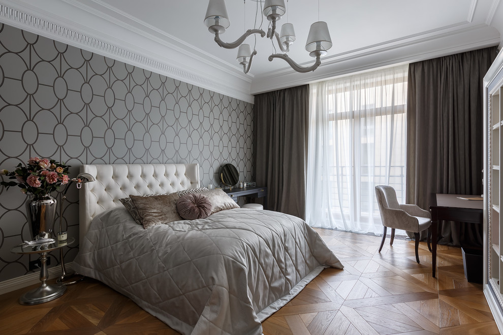 Inspiration for a mid-sized transitional bedroom in Saint Petersburg with grey walls, medium hardwood floors, no fireplace and brown floor.