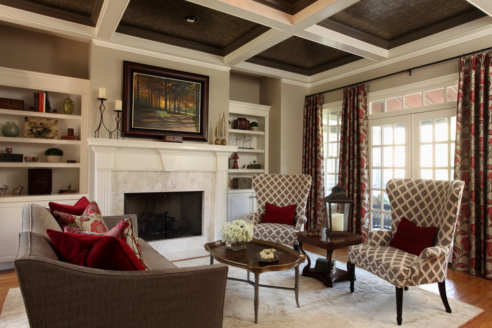 This is an example of a mid-sized traditional formal open concept living room in Atlanta with grey walls, medium hardwood floors, a standard fireplace, a stone fireplace surround, no tv and brown floor.