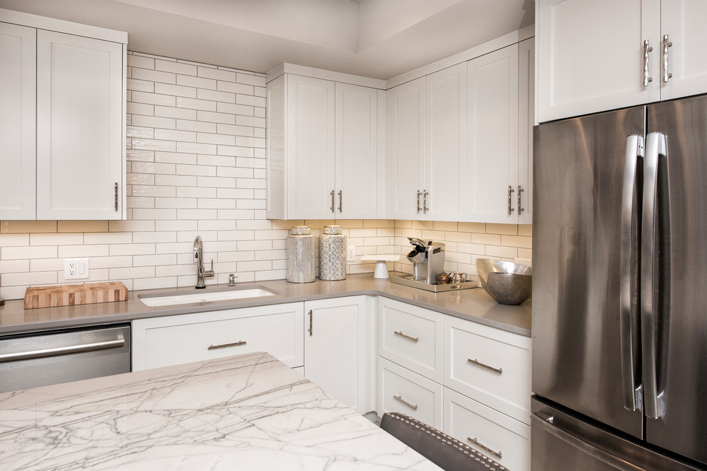 Eat-in kitchen - mid-sized transitional l-shaped eat-in kitchen idea with flat-panel cabinets, white cabinets and an island
