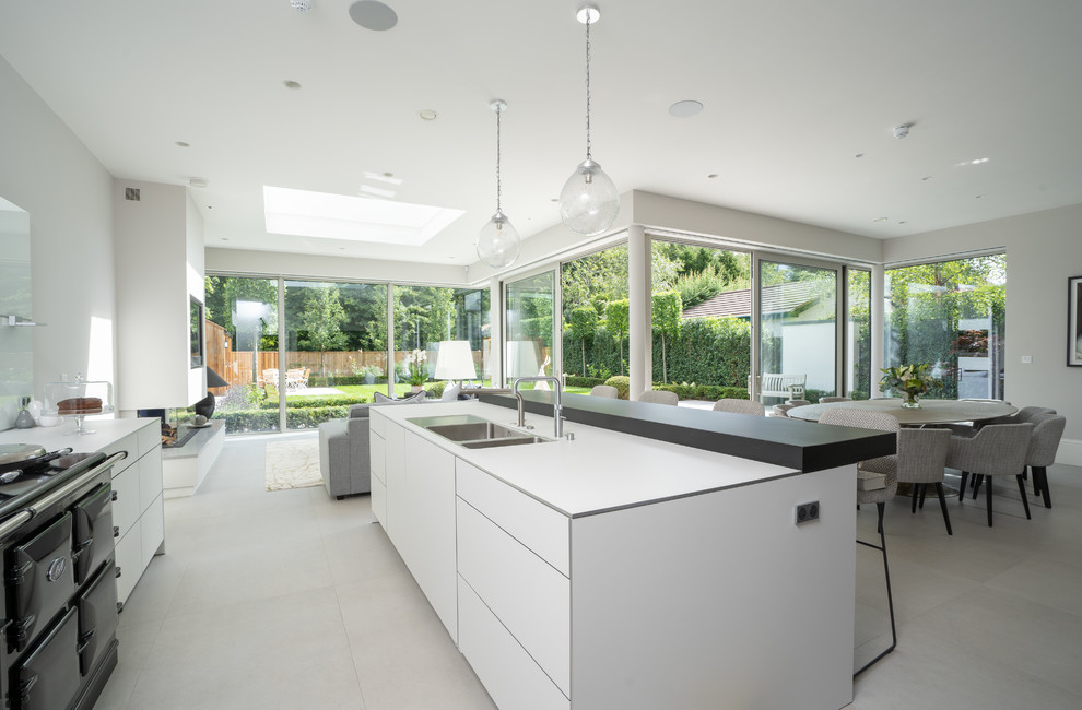 Inspiration for a transitional l-shaped open plan kitchen in Belfast with with island.