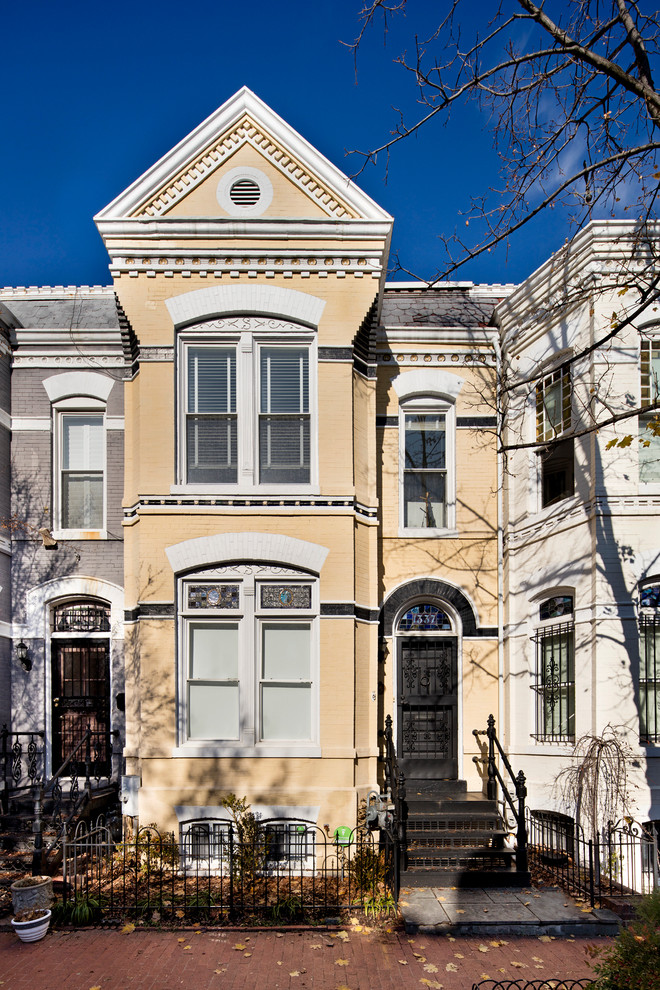 Design ideas for a traditional yellow exterior in DC Metro.