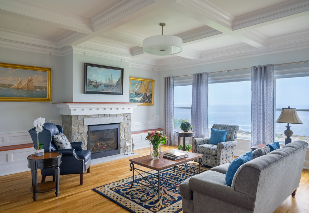 Design ideas for a large traditional formal open concept living room in Boston with blue walls, light hardwood floors, a standard fireplace, a stone fireplace surround and no tv.