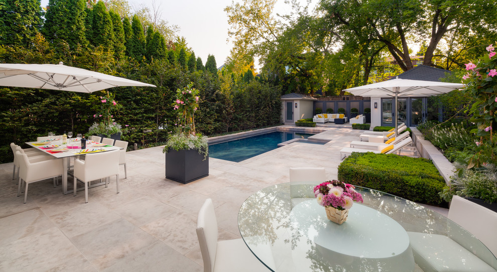 Pool - mid-sized modern backyard stone and rectangular pool idea