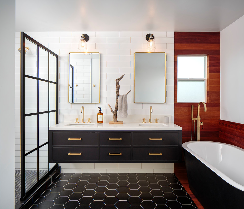 Photo of a mid-sized contemporary master bathroom in San Diego with flat-panel cabinets, black cabinets, a freestanding tub, an open shower, white tile, porcelain tile, white walls, cement tiles, an undermount sink, engineered quartz benchtops, black floor, an open shower and white benchtops.