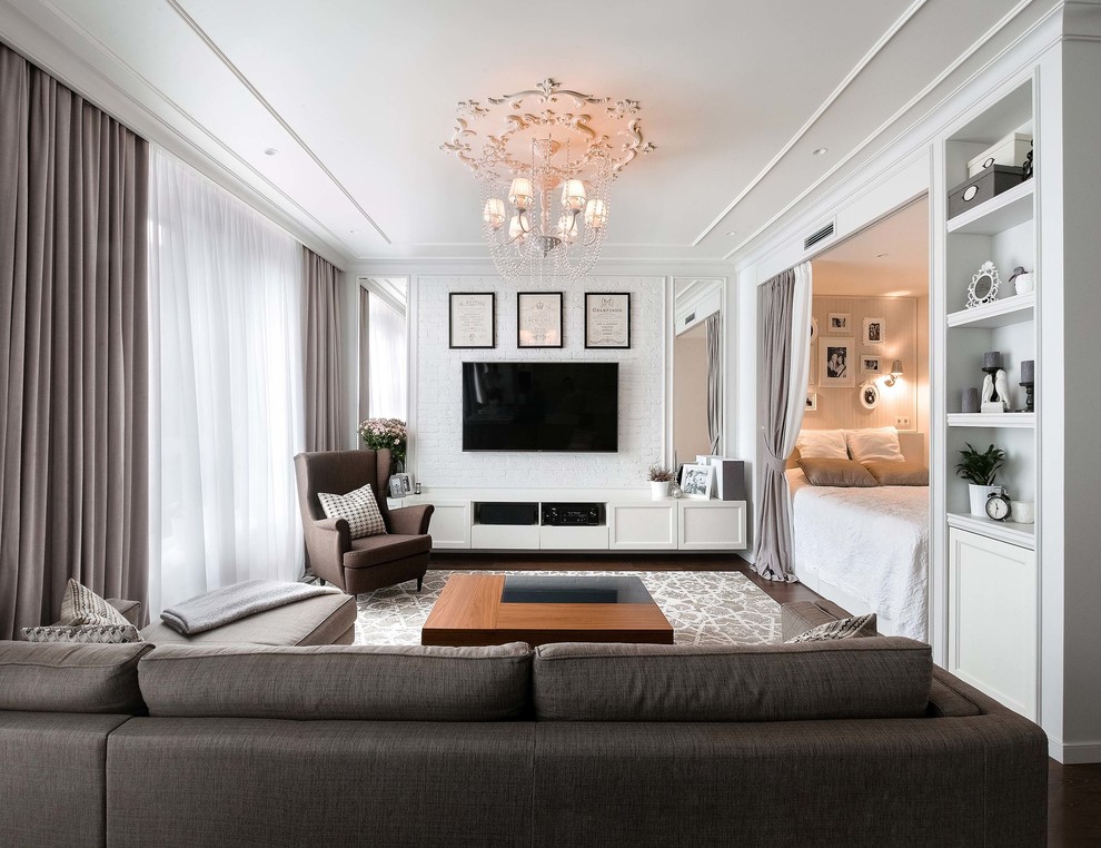 This is an example of a small contemporary formal open concept living room in Moscow with white walls, plywood floors, a wall-mounted tv and brown floor.