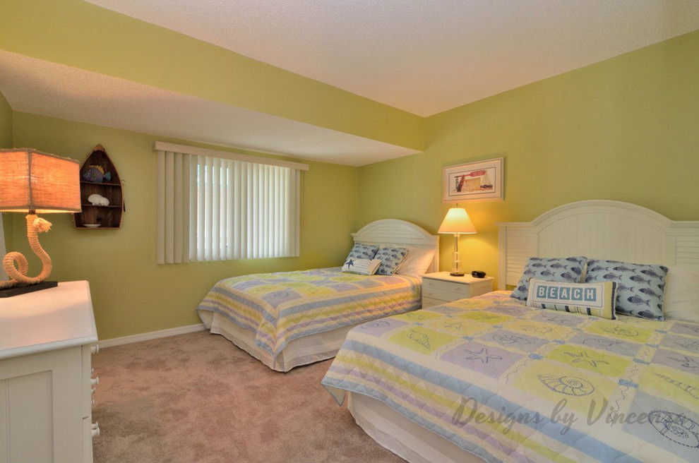 Design ideas for a mid-sized beach style guest bedroom in Tampa with green walls, carpet and no fireplace.