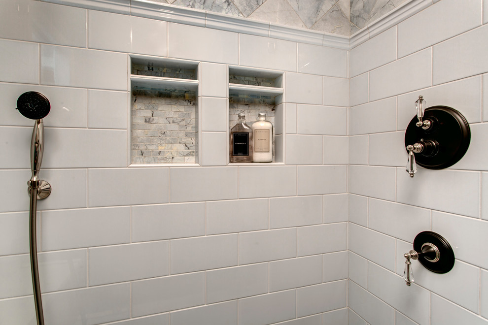 Photo of a small traditional master bathroom in Seattle with raised-panel cabinets, grey cabinets, an alcove shower, a one-piece toilet, blue tile, ceramic tile, grey walls, porcelain floors, an undermount sink, engineered quartz benchtops, grey floor and a hinged shower door.