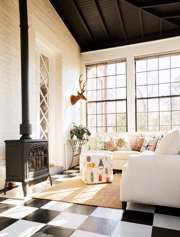 Photo of an eclectic enclosed living room in Richmond with white walls, a wood stove and multi-coloured floor.