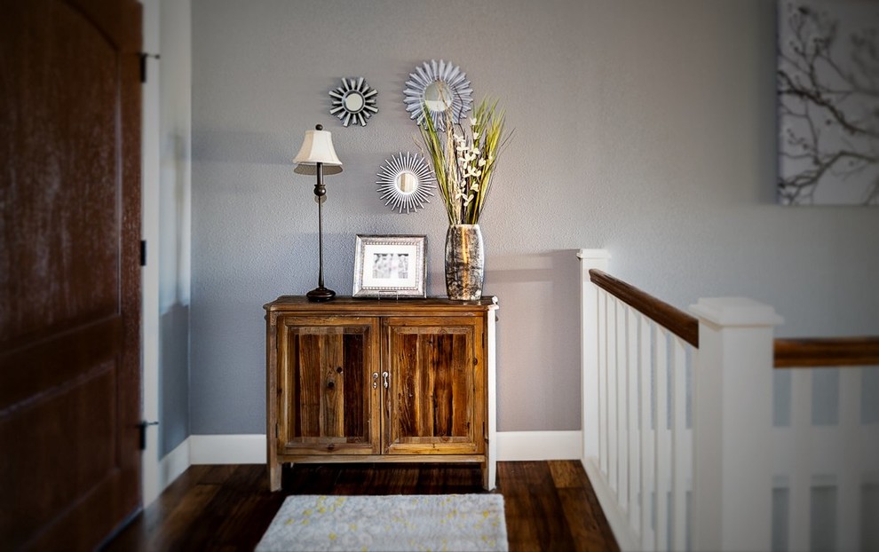 Mid-sized transitional dark wood floor and brown floor hallway photo with gray walls