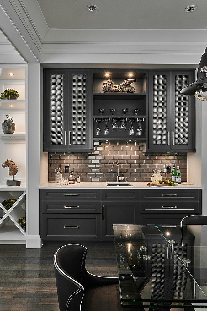 Wet bar - small transitional single-wall dark wood floor and brown floor wet bar idea in Other with an undermount sink, shaker cabinets, black cabinets, gray backsplash, subway tile backsplash, white countertops and quartz countertops