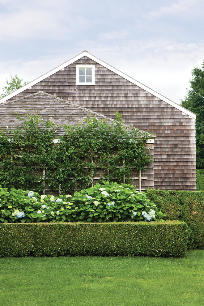 This is an example of a traditional garden in New York with a vertical garden.