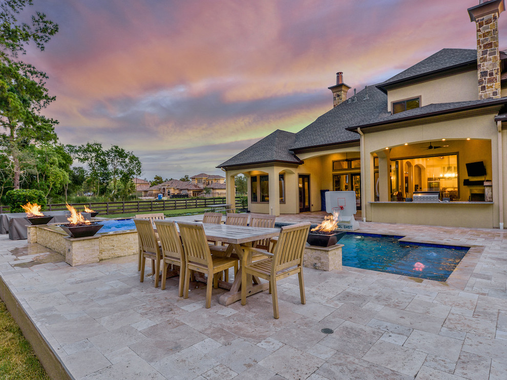 Inspiration for a large transitional backyard stone and rectangular natural hot tub remodel in Houston