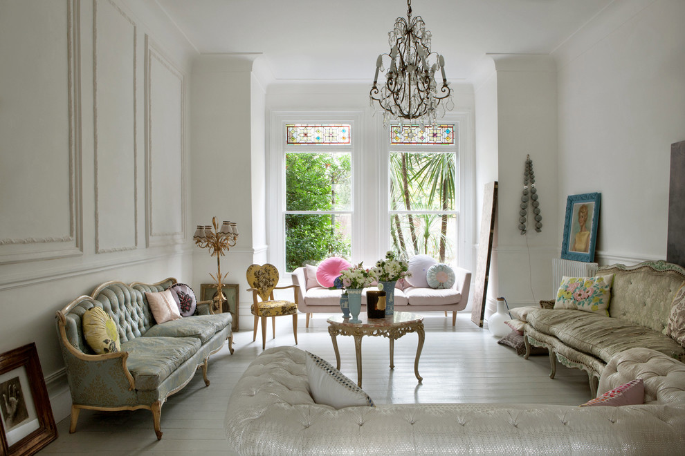 Photo of a traditional formal living room in London with white walls.