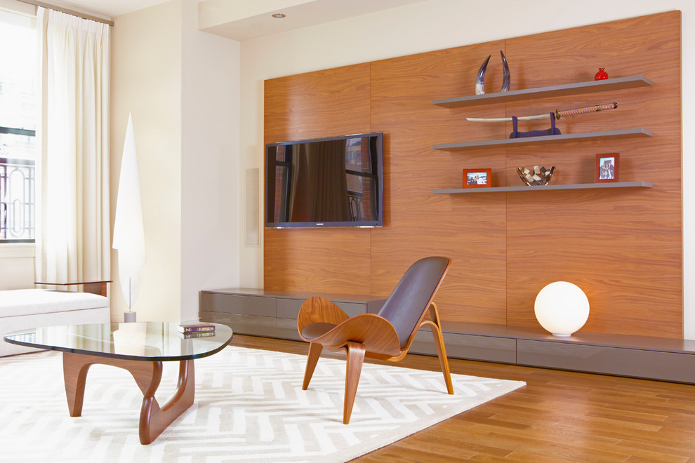 Modern living room in New York with a wall-mounted tv.