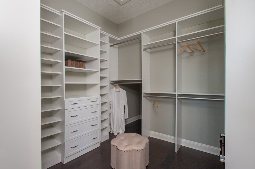 Mid-sized contemporary women's walk-in wardrobe in Jacksonville with beaded inset cabinets, white cabinets and vinyl floors.