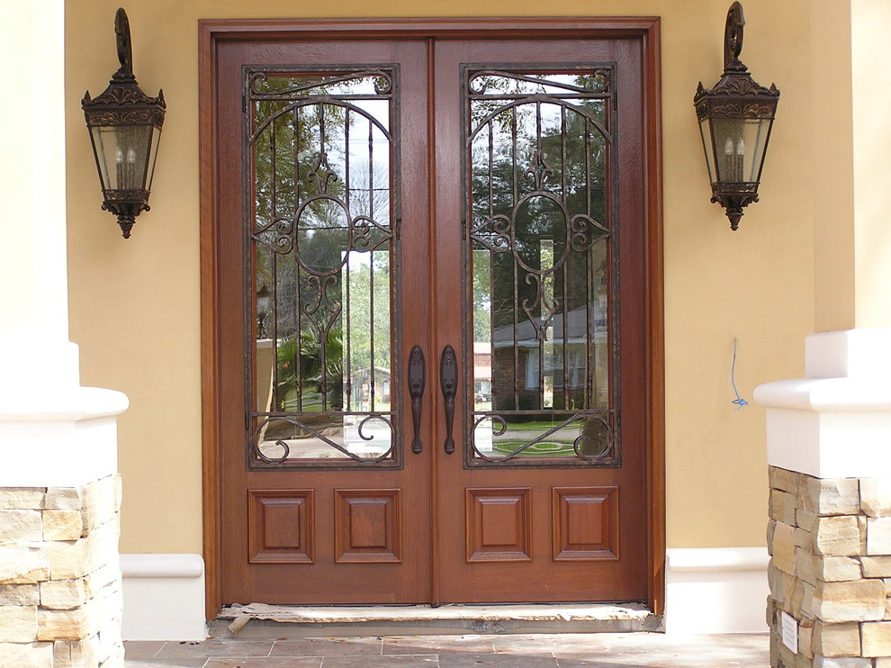 Front door - large rustic front door idea in Miami with beige walls and a dark wood front door