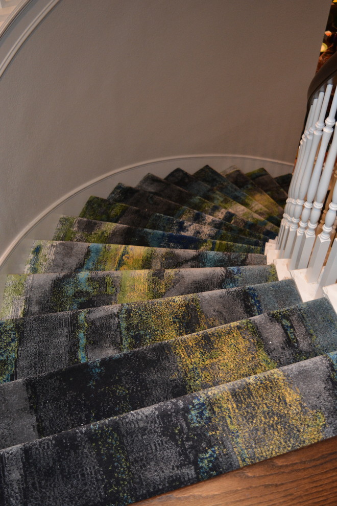 Contemporary carpeted curved staircase in Dallas with carpet risers.