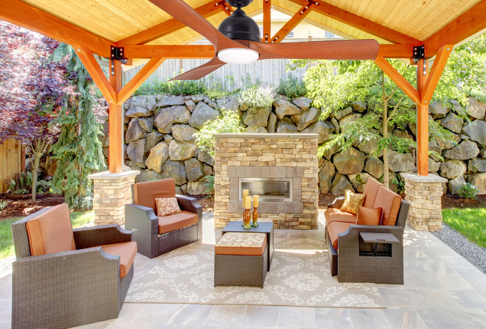 Design ideas for a traditional patio in Seattle with a fire feature and a gazebo/cabana.