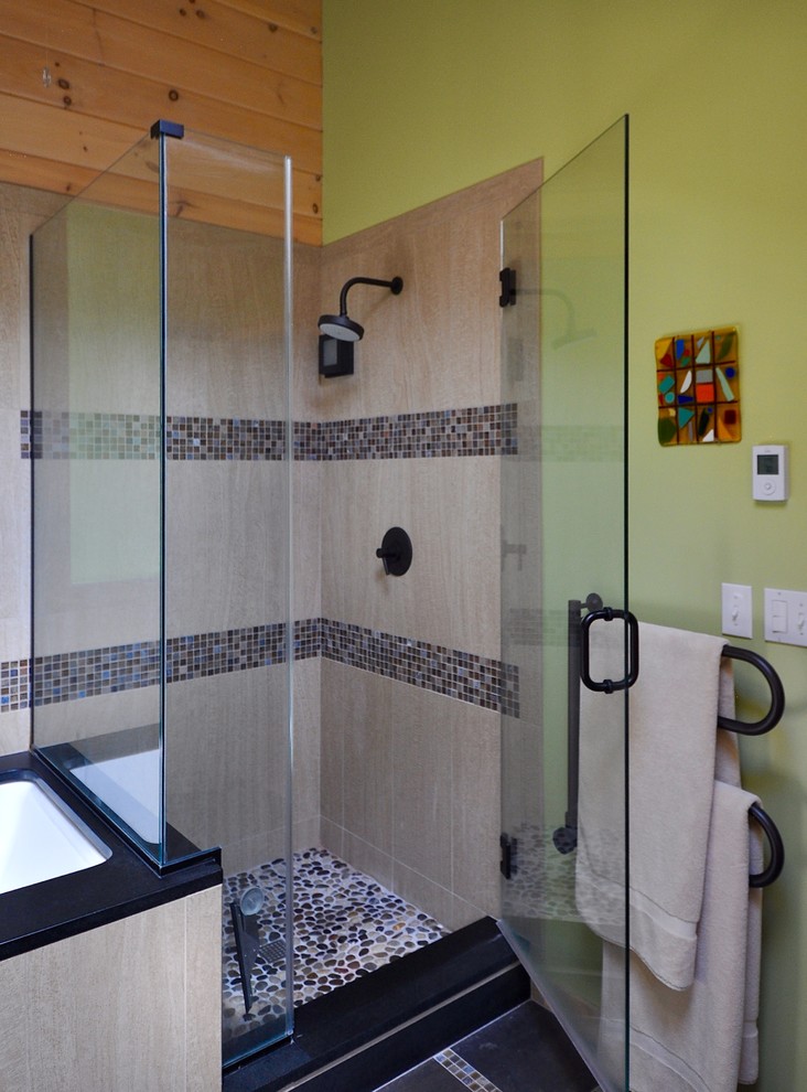 Photo of a mid-sized arts and crafts master bathroom in Manchester with an integrated sink, an undermount tub, a corner shower, a one-piece toilet, brown tile, mosaic tile, green walls and porcelain floors.