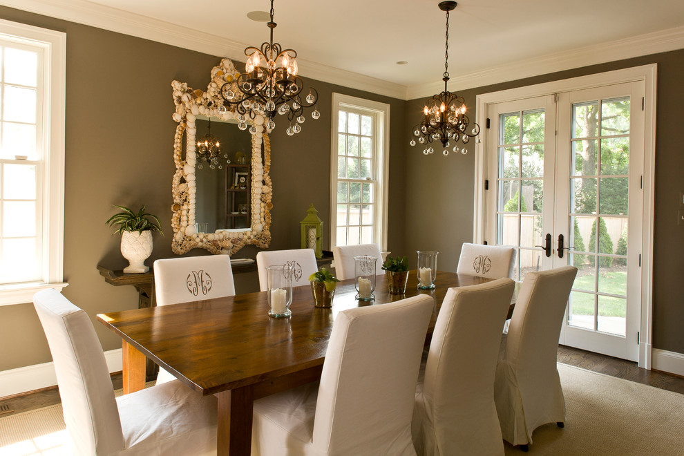 Inspiration for a mid-sized separate dining room in DC Metro with brown walls, dark hardwood floors, no fireplace and brown floor.