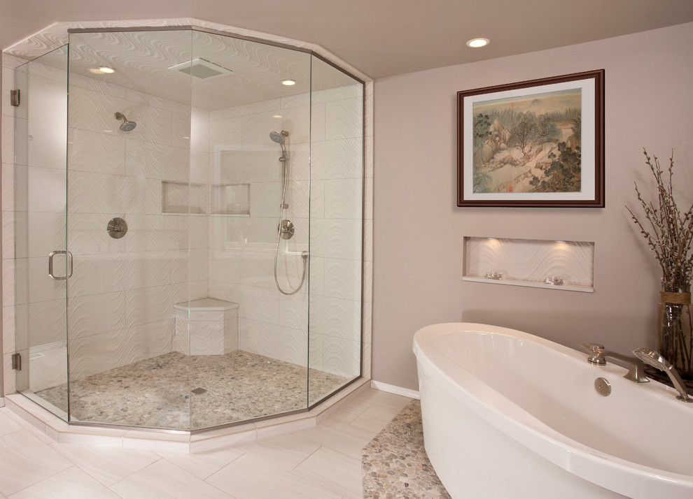 This is an example of a large contemporary master bathroom in Seattle with an undermount sink, flat-panel cabinets, dark wood cabinets, engineered quartz benchtops, a freestanding tub, a double shower, a two-piece toilet, beige tile, porcelain tile, brown walls and porcelain floors.
