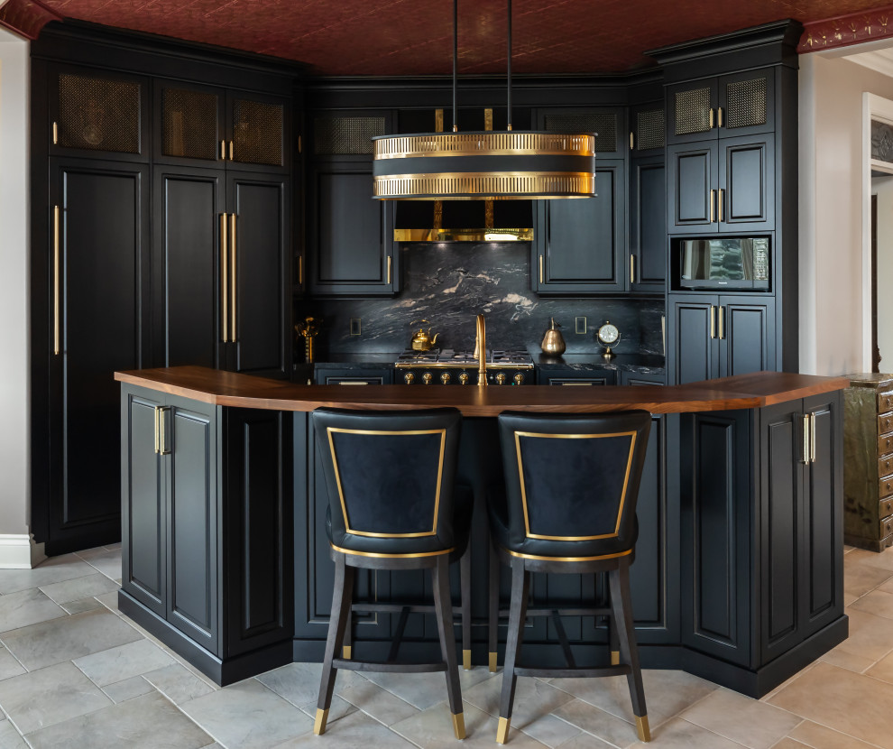 Inspiration for a large eclectic kitchen remodel with raised-panel cabinets, black cabinets, granite countertops, black backsplash, granite backsplash, paneled appliances, an island and black countertops