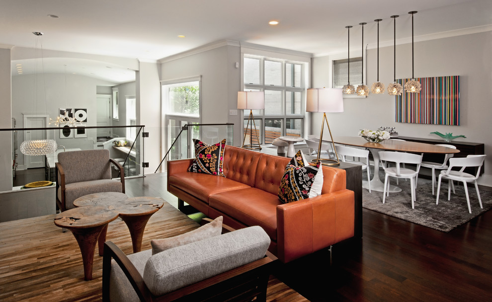 Photo of a contemporary open concept family room in Chicago with grey walls, dark hardwood floors and brown floor.
