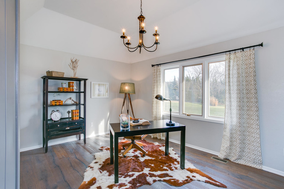 Country study room in Wichita with grey walls, medium hardwood floors and a freestanding desk.