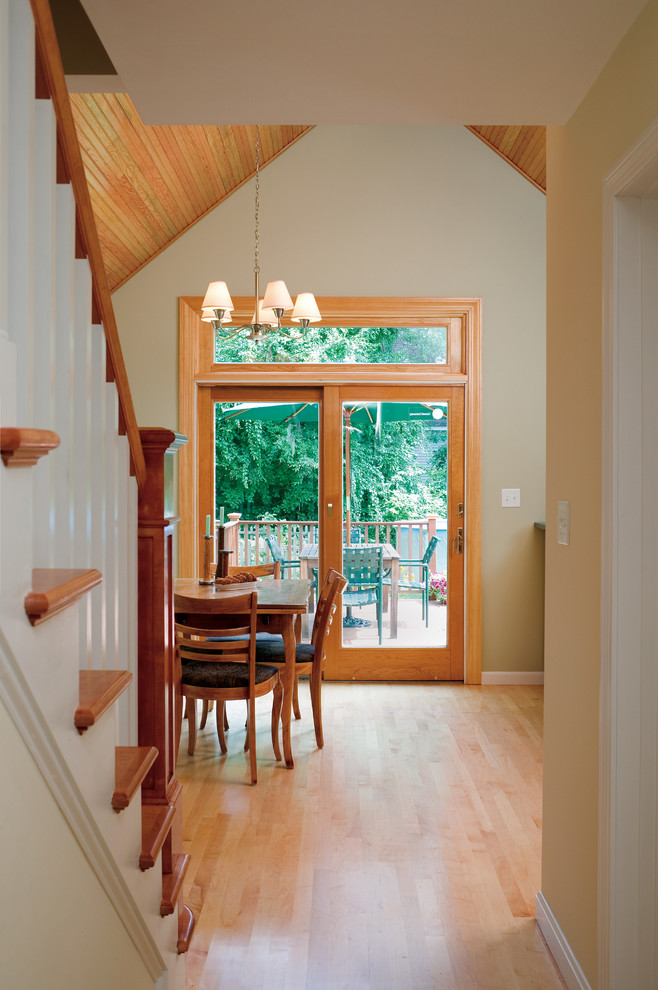 Inspiration for a mid-sized traditional wood straight staircase in Boston with wood risers.