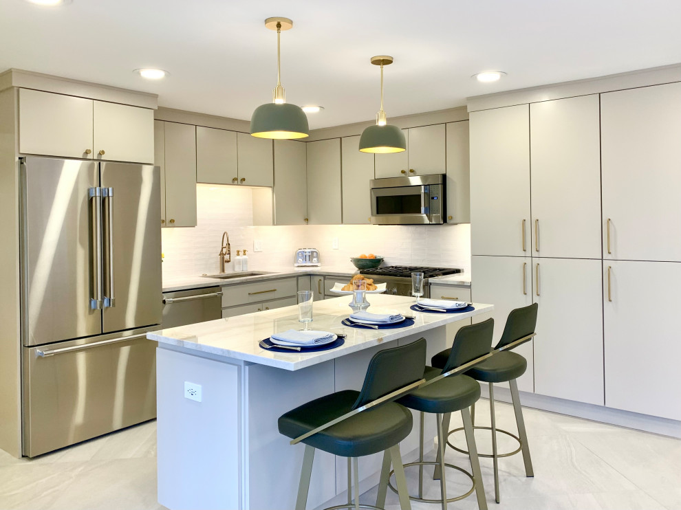 Inspiration for a large modern l-shaped porcelain tile and beige floor kitchen pantry remodel with a single-bowl sink, flat-panel cabinets, beige cabinets, quartzite countertops, white backsplash, porcelain backsplash, stainless steel appliances, an island and beige countertops
