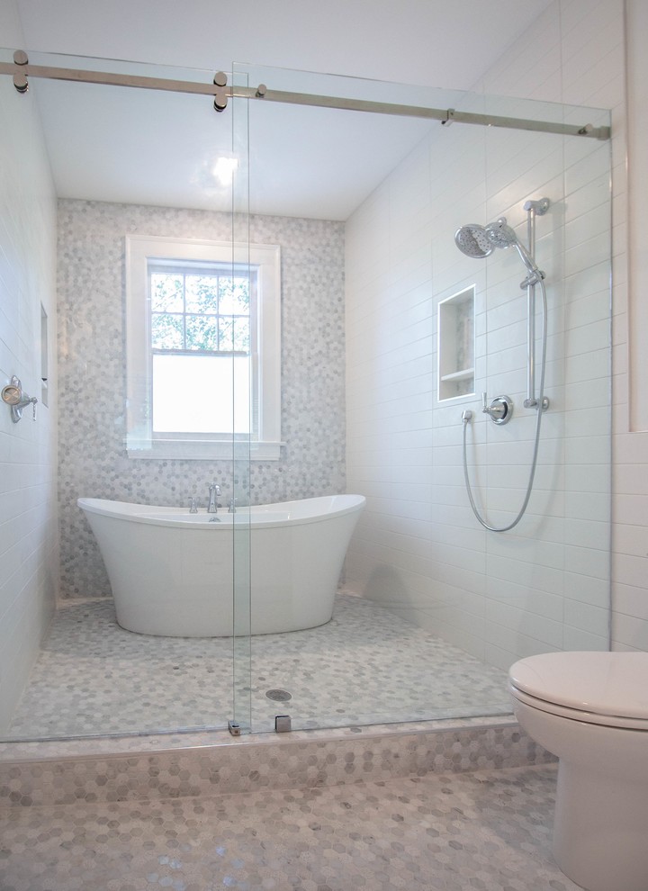 Inspiration for a transitional master bathroom in Jacksonville with shaker cabinets, white cabinets, a freestanding tub, a shower/bathtub combo, white tile, white walls, marble floors, an undermount sink, marble benchtops, a sliding shower screen and multi-coloured benchtops.