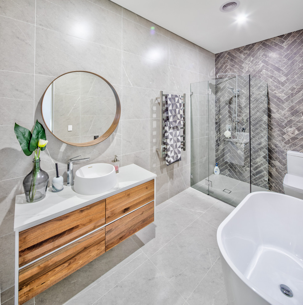 Photo of a large modern master bathroom in Sydney with white cabinets, a freestanding tub, beige tile, cement tile, beige walls, ceramic floors, a drop-in sink, marble benchtops, beige floor, an open shower, white benchtops, a shower seat, a single vanity and a floating vanity.
