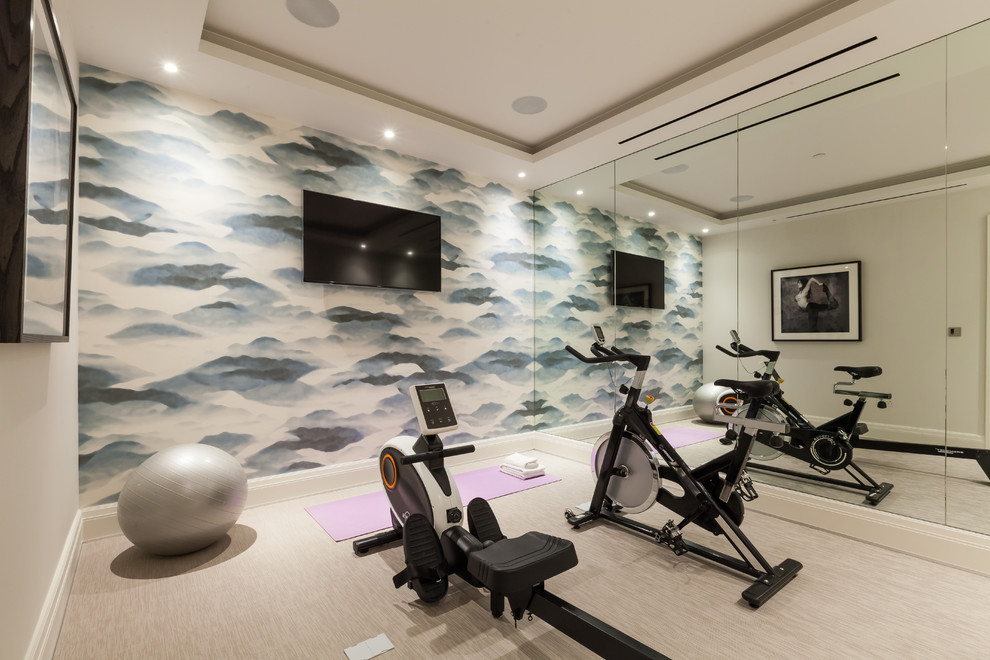 Contemporary multipurpose gym in London with beige walls and beige floor.