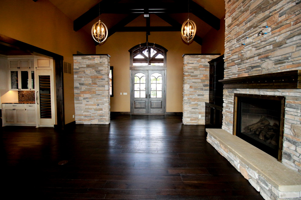 Foyer - rustic dark wood floor and exposed beam foyer idea in Seattle with a dark wood front door