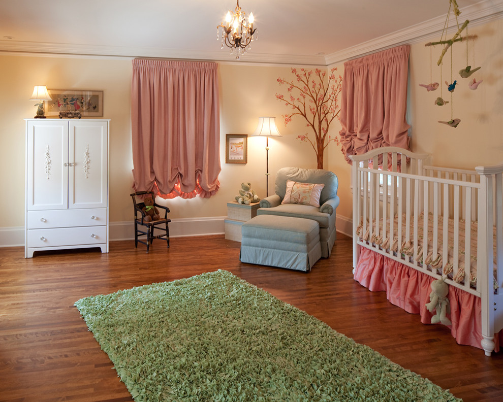 Large traditional kids' room in Minneapolis with beige walls and medium hardwood floors for girls.