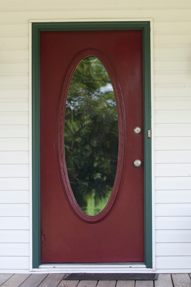 Inspiration for a small transitional front door remodel with white walls and a red front door