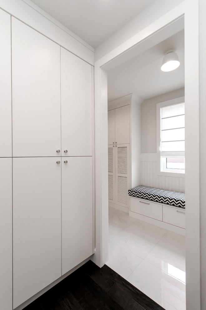 Example of a large transitional dark wood floor mudroom design in Edmonton with white walls