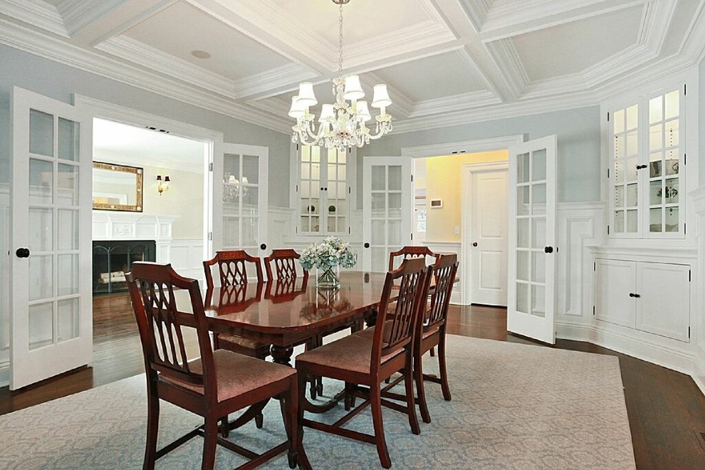 Photo of a large transitional separate dining room in New York with blue walls, light hardwood floors and no fireplace.