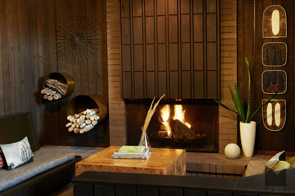 Mid-sized mid-century modern formal and open concept concrete floor living room photo in Salt Lake City with brown walls, a standard fireplace, a brick fireplace and no tv