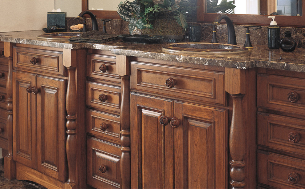 Inspiration for a large transitional master bathroom remodel with raised-panel cabinets, dark wood cabinets and a drop-in sink