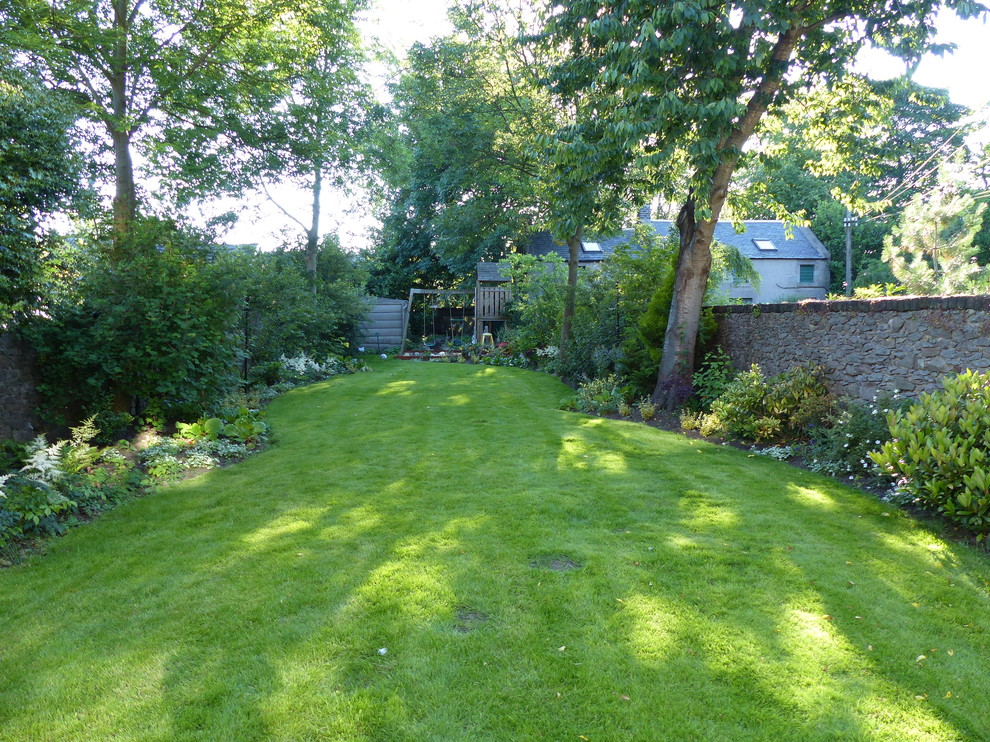 This is an example of a mid-sized traditional garden in Other.