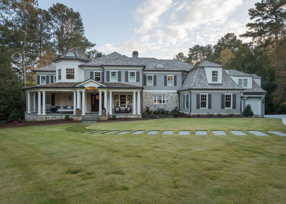 Inspiration for a traditional two-storey grey exterior in Atlanta with a hip roof and a shingle roof.