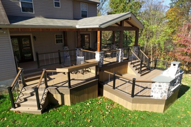 Example of a large mountain style home design design