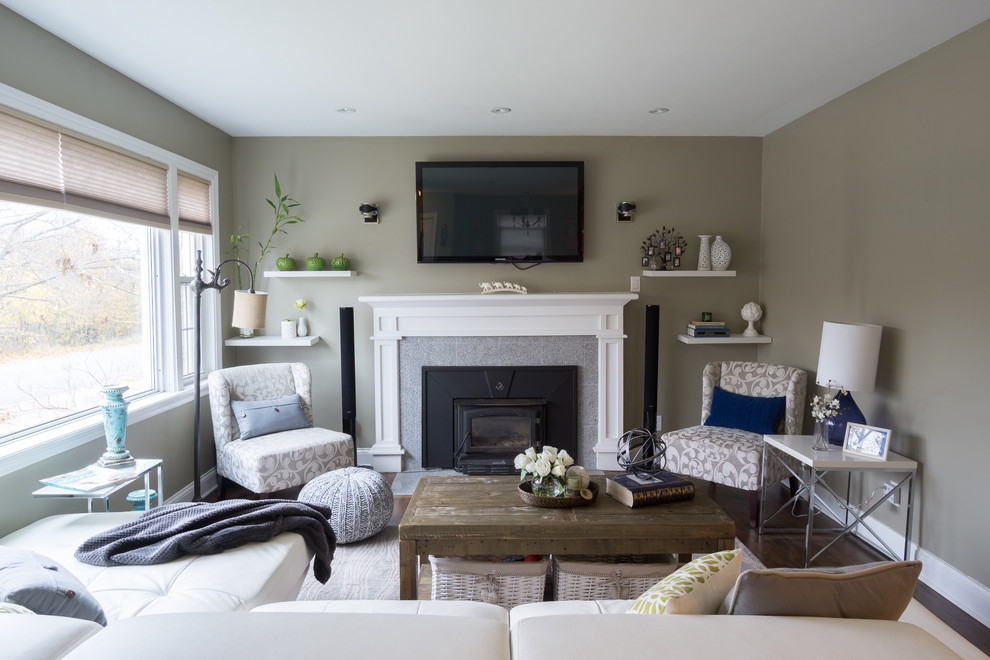 This is an example of a small transitional enclosed living room in Other with grey walls, dark hardwood floors, a standard fireplace, a tile fireplace surround and a wall-mounted tv.