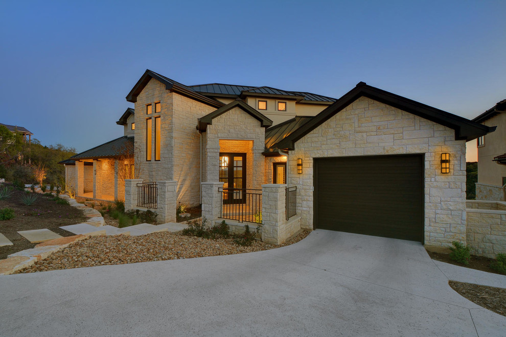 Example of a large transitional white two-story stone exterior home design in Austin with a hip roof