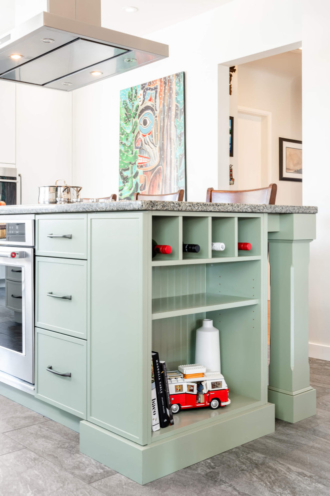Eat-in kitchen - mid-sized transitional galley eat-in kitchen idea with shaker cabinets and an island
