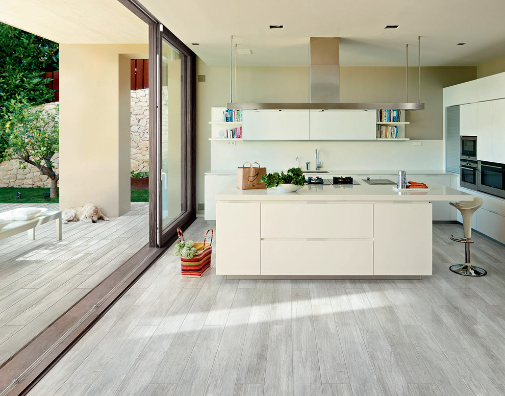 This is an example of a contemporary kitchen in Other with grey floor.