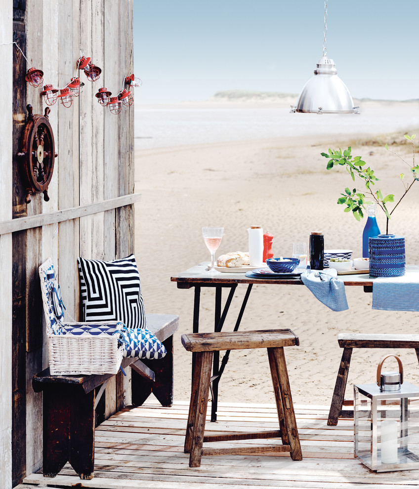 Design ideas for a beach style home design in London.