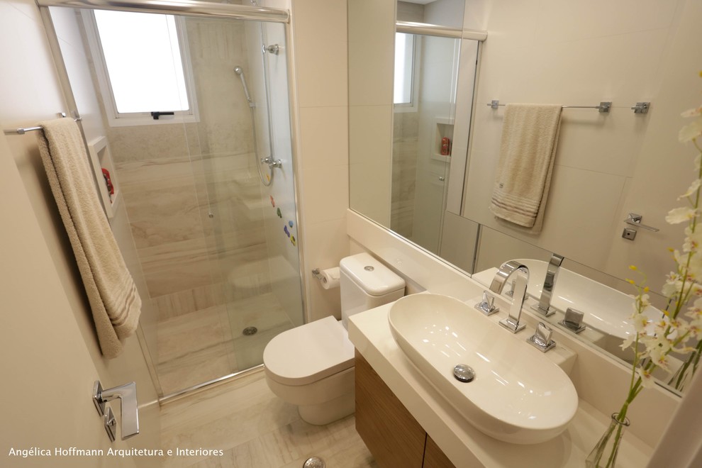 This is an example of a small contemporary bathroom in Other with flat-panel cabinets, dark wood cabinets, an alcove shower, a one-piece toilet, beige tile, stone tile, beige walls, ceramic floors, a console sink, quartzite benchtops, beige floor and a sliding shower screen.