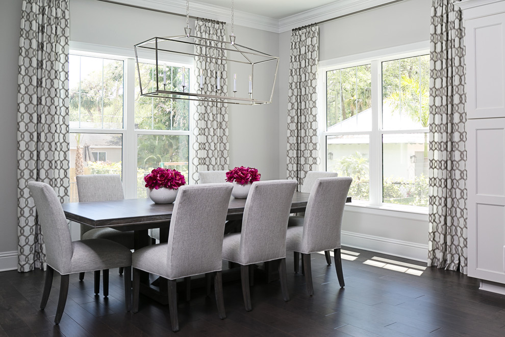 Photo of a transitional separate dining room in Tampa with grey walls, dark hardwood floors and no fireplace.